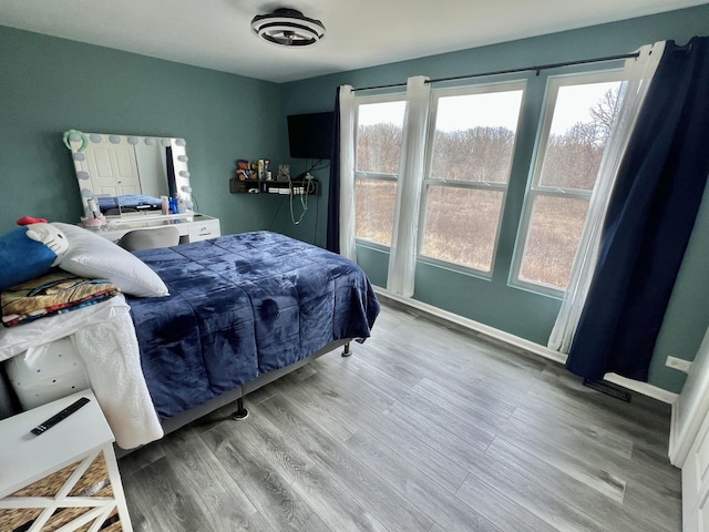 bedroom with wood finished floors