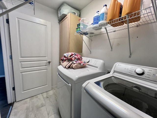 laundry room featuring cabinet space and washing machine and clothes dryer