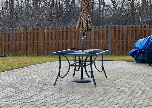 view of patio / terrace featuring fence