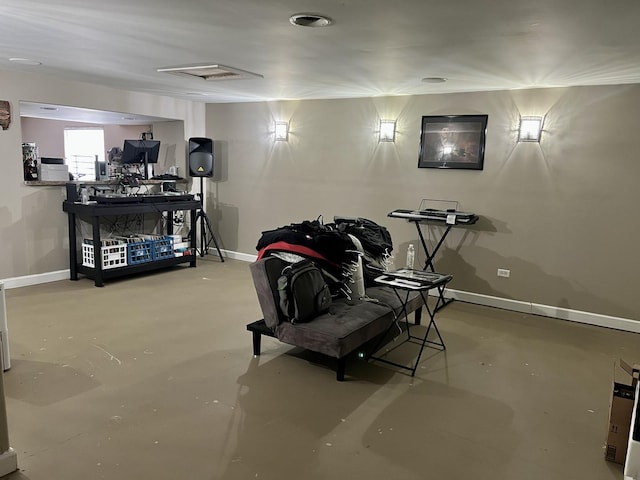 interior space with baseboards and finished concrete floors