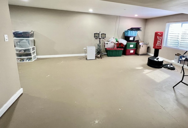 basement featuring recessed lighting and baseboards