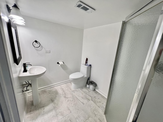 full bathroom with visible vents, a shower stall, toilet, and baseboards