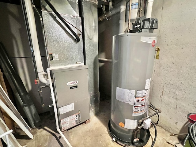 utility room featuring gas water heater