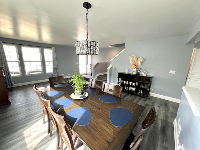 dining area with stairway, baseboards, an inviting chandelier, and wood finished floors