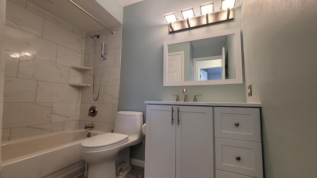 bathroom featuring baseboards, toilet, bathtub / shower combination, and vanity