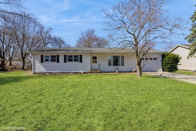 ranch-style house featuring concrete driveway, an attached garage, and a front lawn