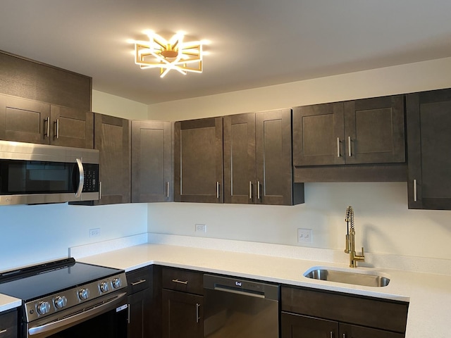 200 Park Ave Unit 531, Calumet City, IL 60409 - kitchen with stainless steel appliances, light countertops, and dark brown cabinetry