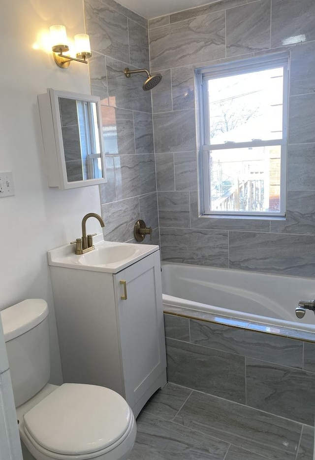 8416 S Bennett Ave, Chicago, IL 60617 - full bath with tiled shower / bath, toilet, and vanity