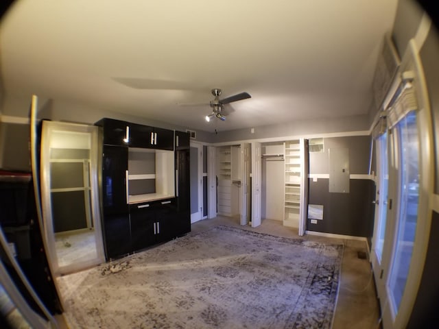 interior space with visible vents, multiple closets, and ceiling fan