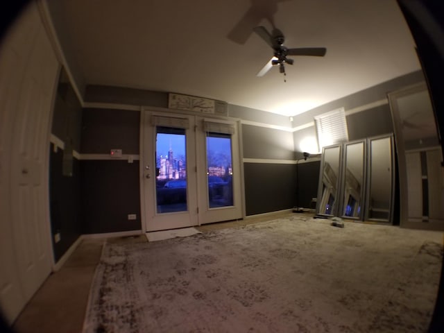 interior space with ceiling fan