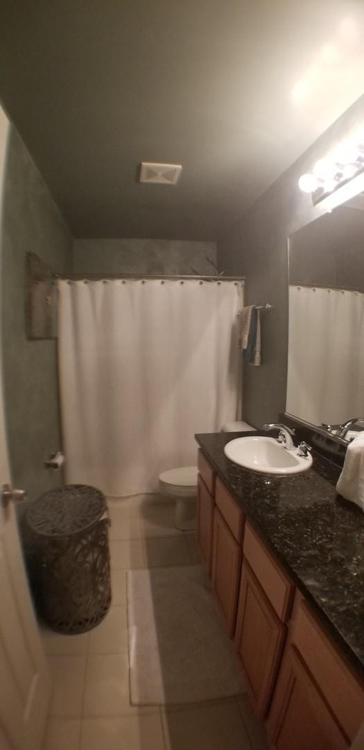 full bath featuring tile patterned floors, visible vents, toilet, and vanity