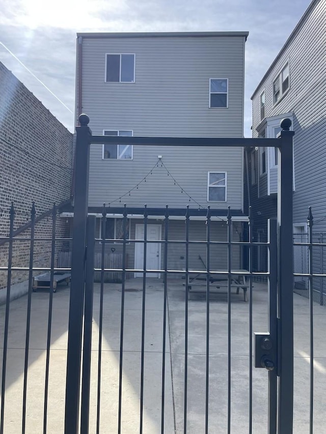 view of gate featuring fence