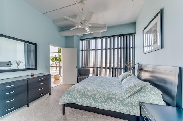 bedroom featuring a ceiling fan and light carpet