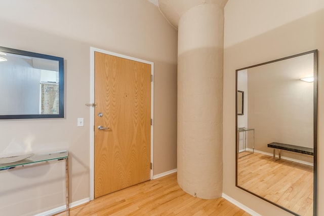 entrance foyer featuring light wood-style flooring and baseboards