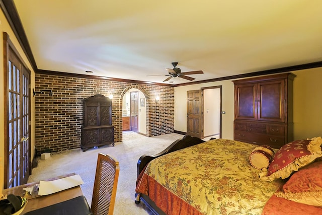 bedroom featuring brick wall and ornamental molding