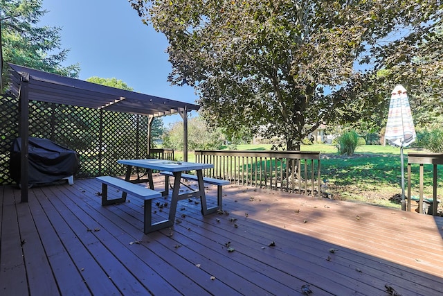 wooden deck featuring grilling area and outdoor dining area