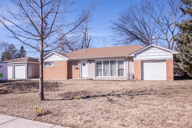 single story home featuring brick siding, roof with shingles, an outdoor structure, and an attached garage