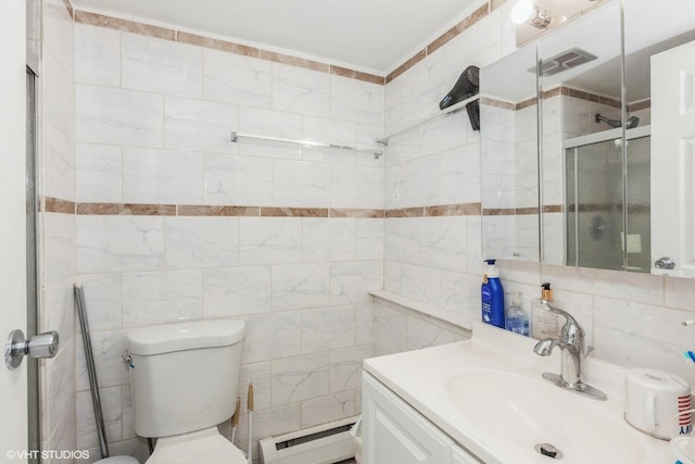 bathroom with visible vents, tile walls, a baseboard heating unit, toilet, and vanity