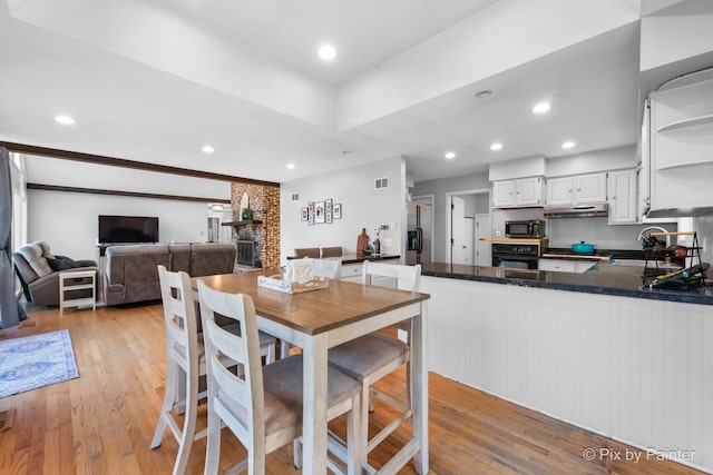 dining room featuring visible vents, recessed lighting, and light wood-style floors