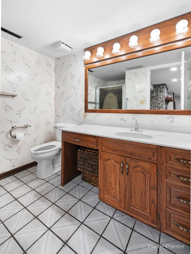 bathroom featuring wallpapered walls, toilet, vanity, and visible vents