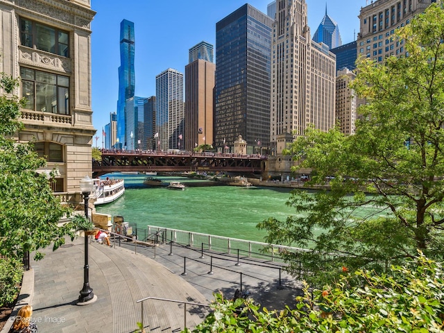 surrounding community featuring a water view and a city view