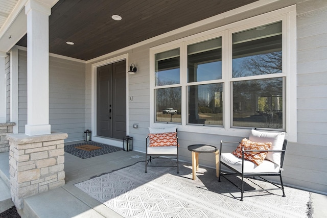 property entrance featuring a porch