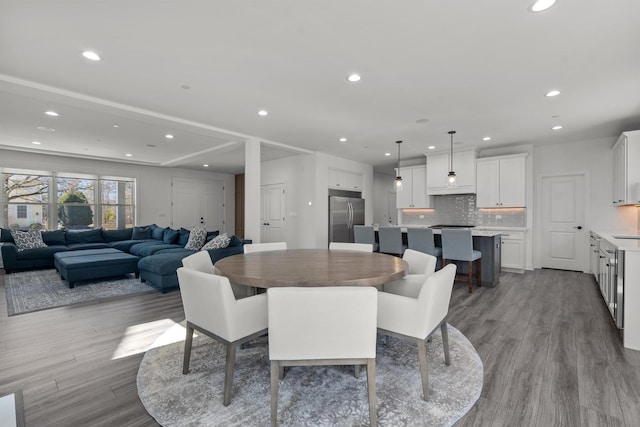 dining room featuring recessed lighting and wood finished floors