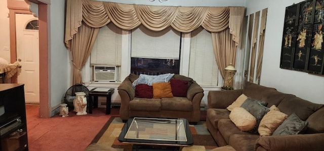 living area featuring cooling unit and carpet floors
