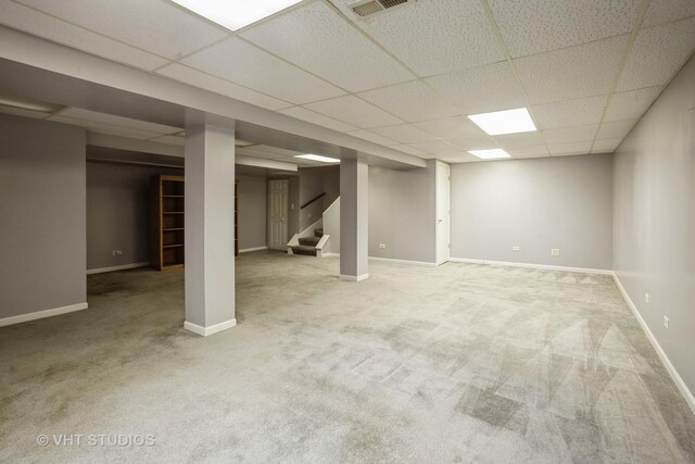214 S Rush St, Itasca, IL 60143 - finished below grade area featuring a paneled ceiling, carpet flooring, stairway, and baseboards