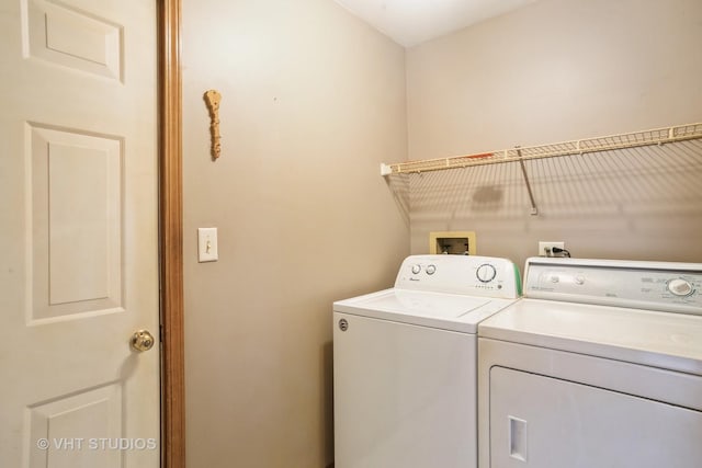 laundry room featuring separate washer and dryer