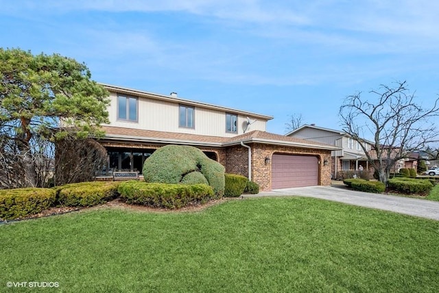 view of front of property with brick siding, a front lawn, concrete driveway, and an attached garage