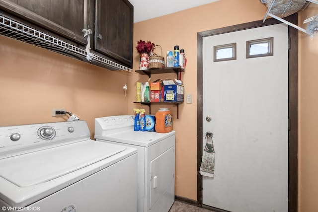 laundry room with cabinet space and washing machine and dryer