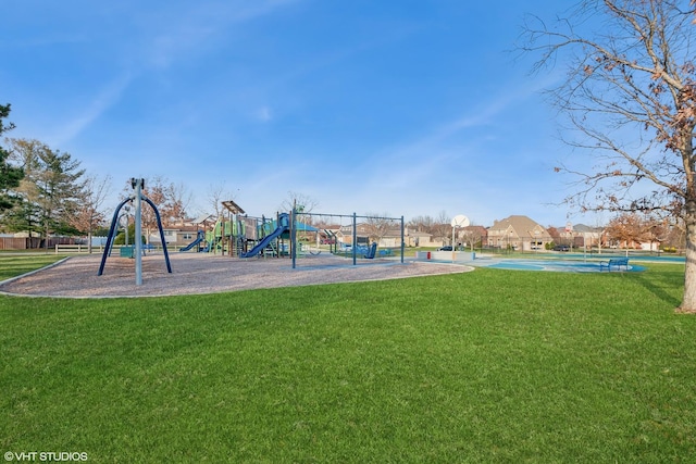 community jungle gym with community basketball court and a yard