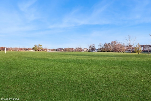 view of home's community featuring a yard