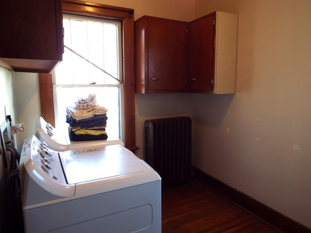 410 S Franklin Ave, Polo, IL 61064 - washroom featuring washer / clothes dryer, radiator heating unit, baseboards, dark wood-style floors, and cabinet space