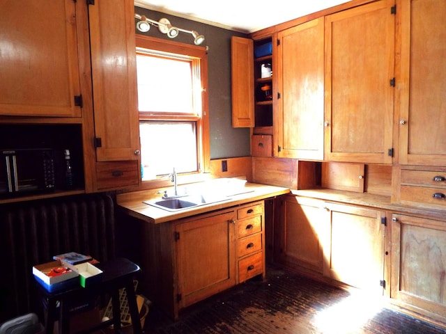 410 S Franklin Ave, Polo, IL 61064 - kitchen featuring a sink, brown cabinetry, light countertops, and open shelves