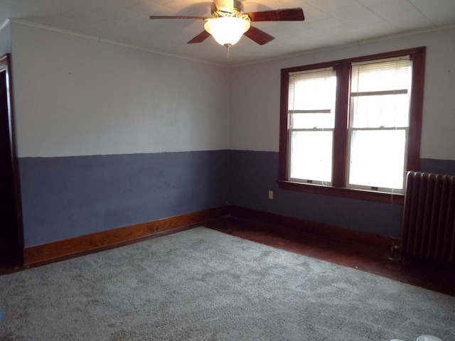 410 S Franklin Ave, Polo, IL 61064 - unfurnished room with baseboards, ornamental molding, carpet flooring, radiator, and ceiling fan