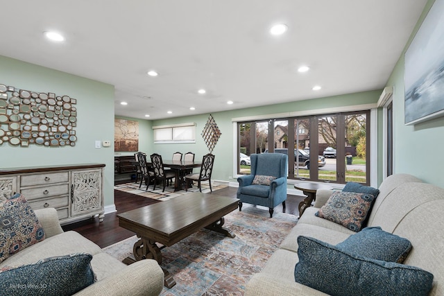 living area featuring recessed lighting, wood finished floors, and baseboards