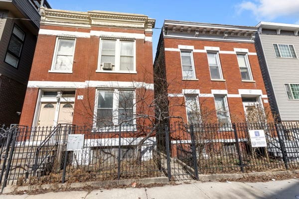 2020 W Superior St, Chicago, IL 60612 - view of property with a fenced front yard and brick siding