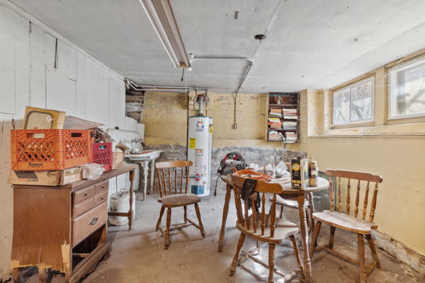 2020 W Superior St, Chicago, IL 60612 - dining space with gas water heater, a workshop area, and concrete floors