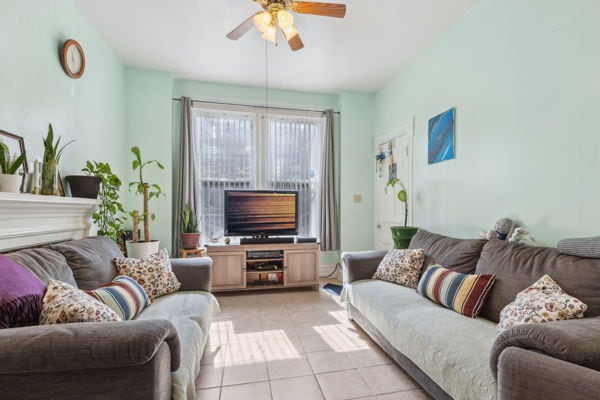 2020 W Superior St, Chicago, IL 60612 - living area with light tile patterned floors and ceiling fan