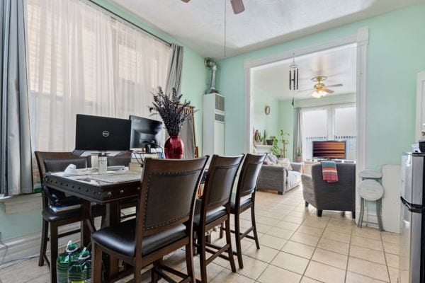 2020 W Superior St, Chicago, IL 60612 - dining room with light tile patterned floors and ceiling fan