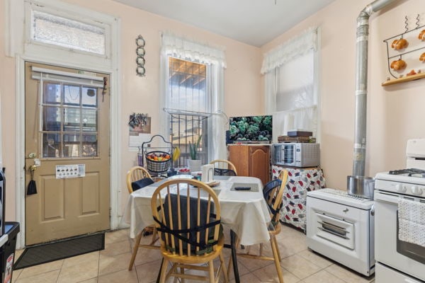 2020 W Superior St, Chicago, IL 60612 - dining room featuring light tile patterned flooring