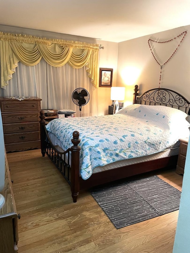 bedroom featuring wood finished floors