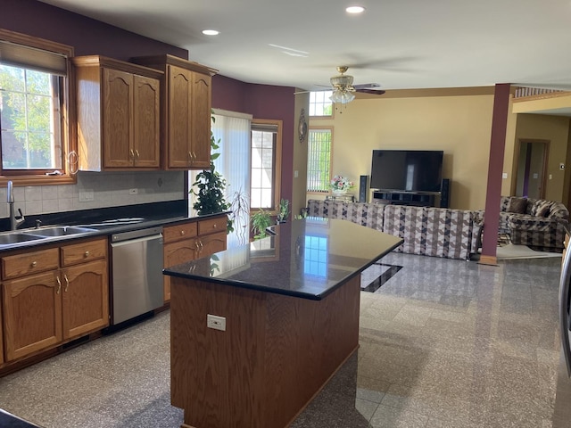 kitchen featuring a ceiling fan, recessed lighting, a sink, dishwasher, and dark countertops