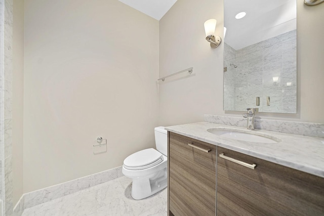 full bathroom featuring toilet, marble finish floor, baseboards, walk in shower, and vanity