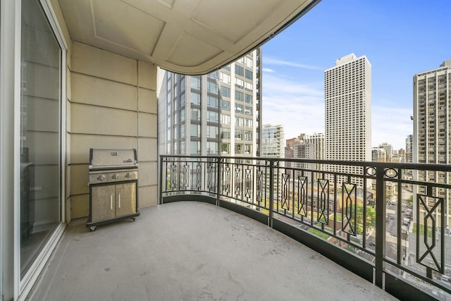 balcony with a city view and grilling area