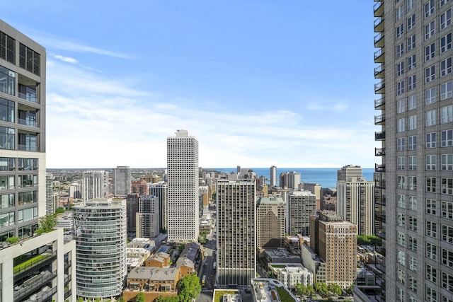 property's view of city featuring a water view