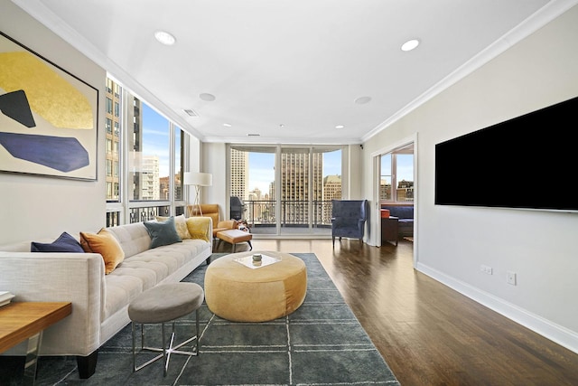 living area with visible vents, ornamental molding, wood finished floors, recessed lighting, and baseboards