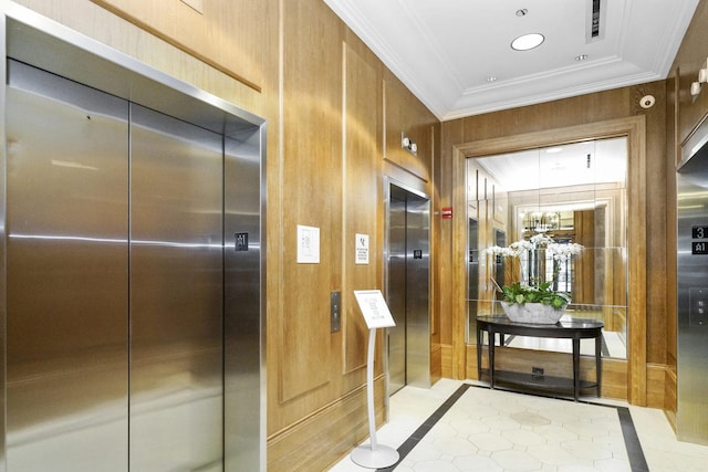 bathroom featuring tile patterned floors, elevator, wooden walls, and ornamental molding